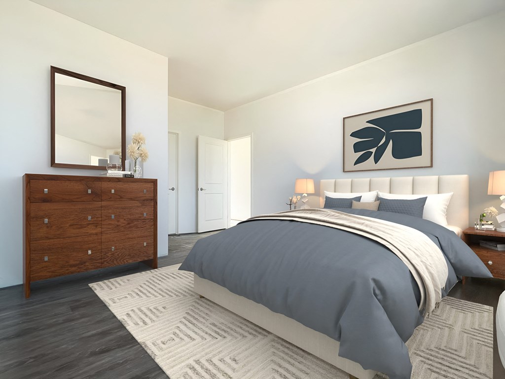 a bedroom with a bed and a dresser and a mirror