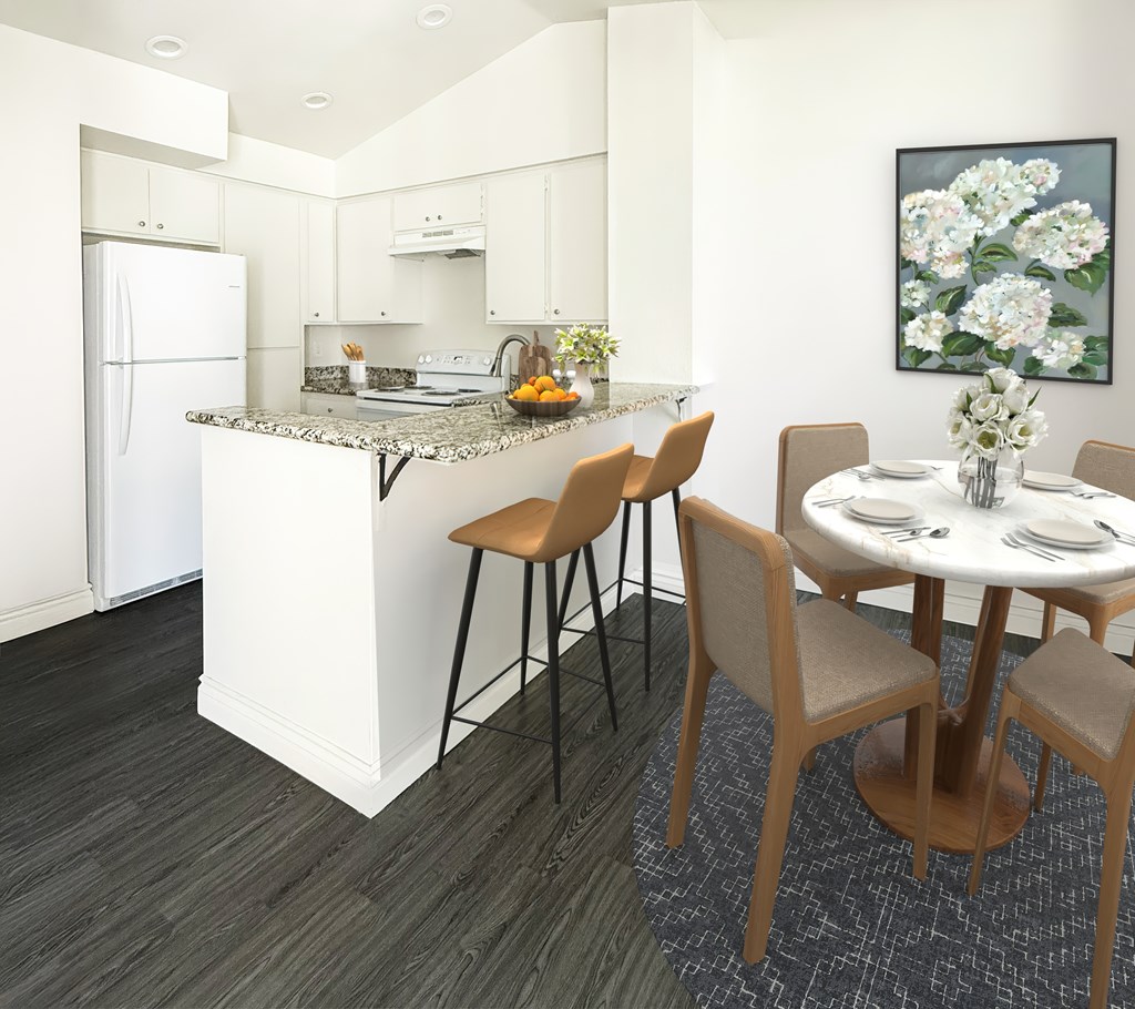 A kitchen with a table and chairs at Ridgeline Apartments in San Bernardino
