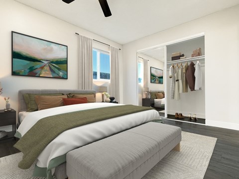 A bedroom with a large bed and a painting on the wall.