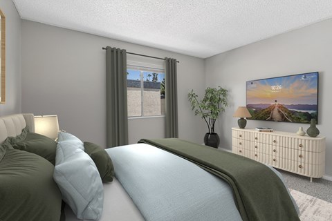 A bedroom with a large bed and a flat screen TV mounted on the wall.