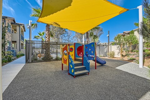 a playground at the enclave at woodbridge apartments in sugar land, tx