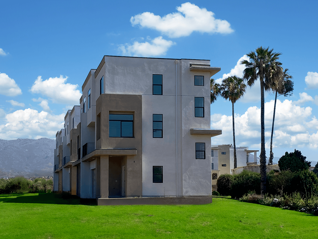 a building with palm trees in front of it