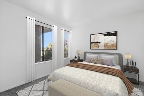 2nd Bedroom in 2 Bedroom California Place apartment home with carpeted flooring and large windows allowing for gorgeous natural light.