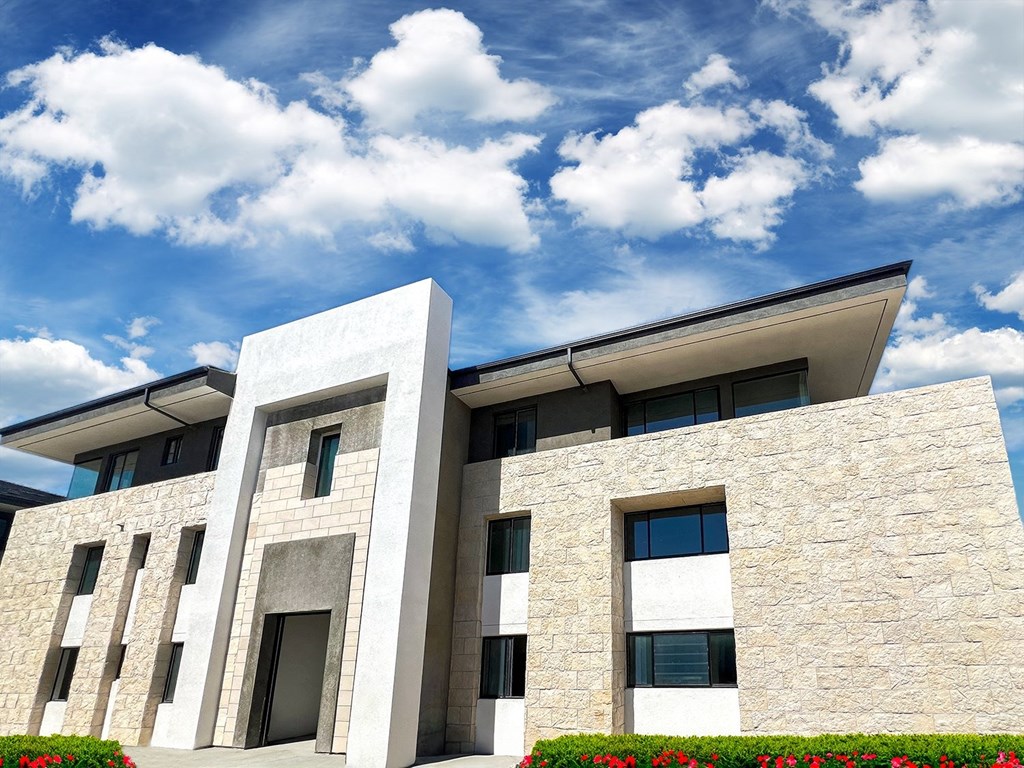 a picture of a building with a blue sky and clouds at The Max on Jefferson Apartments, Murrieta, 92562