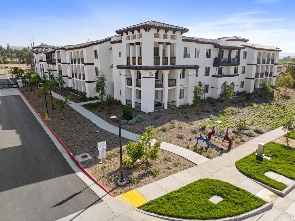 an aerial view of a building with a street in front of it at The Venue at Orange Apartments, California, 92373