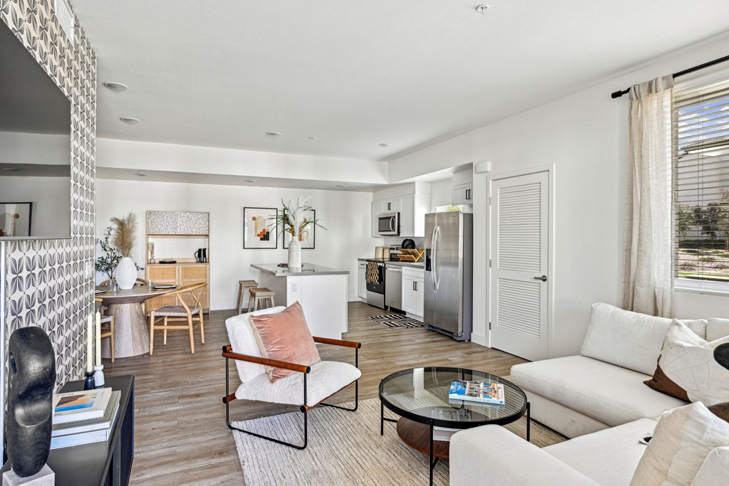 a living room with a couch and a table at The Venue at Orange Apartments, Redlands, 92373