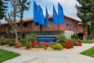 a building with a sign in front of it that says summer meadows