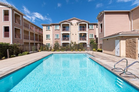Resort-style pool at Turtle Creek Apartment homes at the center of the property within gated pool yard
