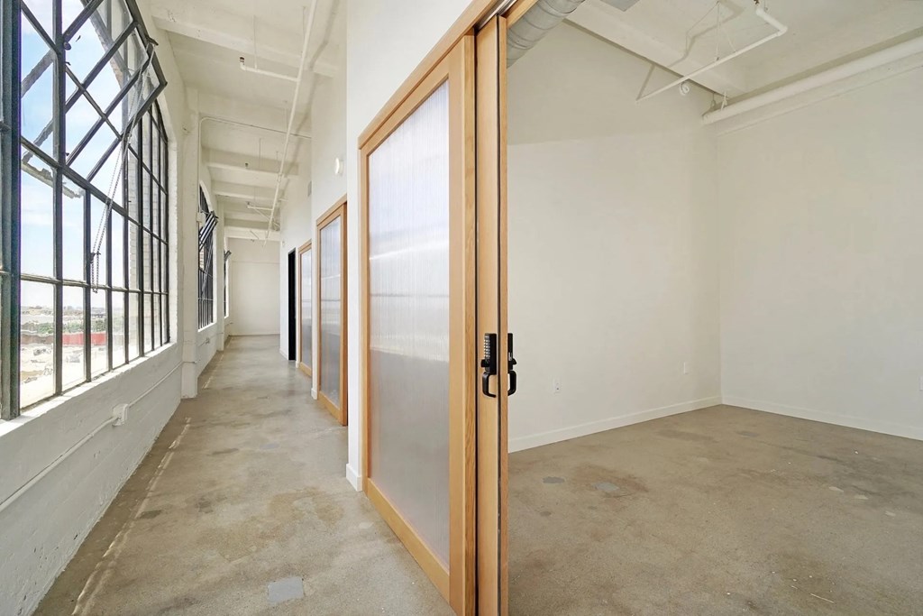 GamerHive Apartments Vacant unit hallway and bedroom