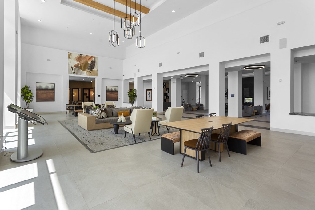 a large living room with a large table and chairs at The Venue at Orange Apartments, California, 92373