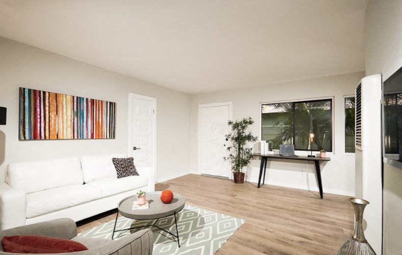 a living room with a white couch and a table