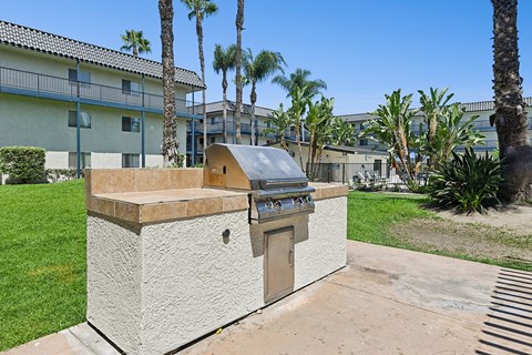 Outdoor BBQ area at Oro surrounded by gorgeous tree lined views