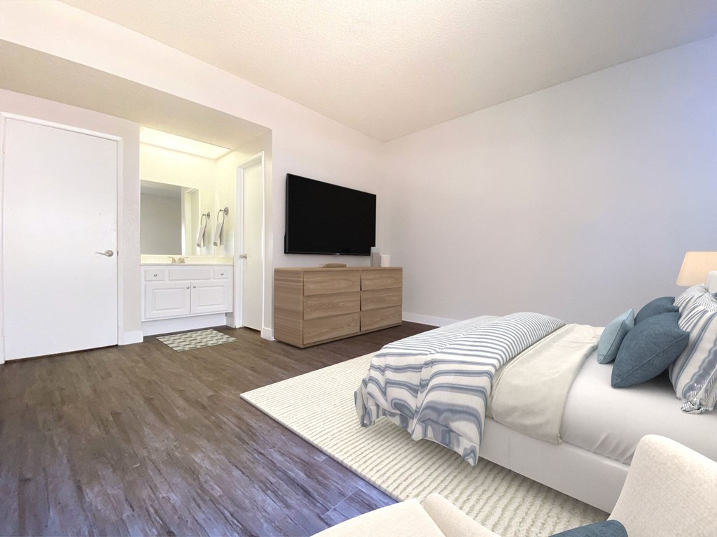 a bedroom with a bed and a tv on the wall at Summer Meadows, Riverside, CA, 92507