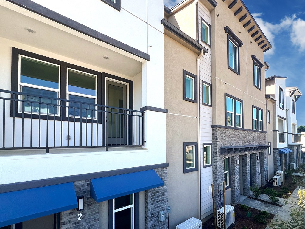 a view of a building with a balcony in front of it at The Willow Townhomes, Ontario, 91762