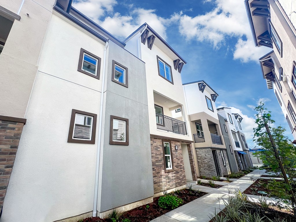 our apartments offer a walkway to the street for residents to enjoy at The Willow Townhomes, CA 91762