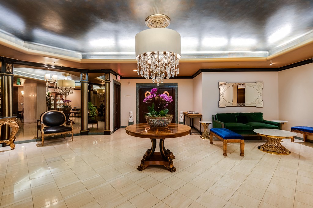 the lobby of a hotel with a chandelier