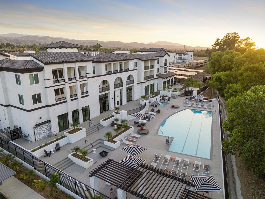 an aerial view of a hotel with a swimming pool at The Venue at Orange Apartments, Redlands