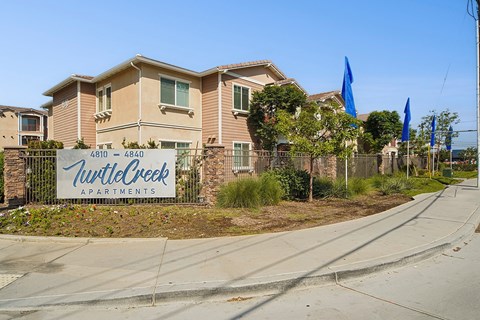 Apartments with a sign that says Twilight Creek.
