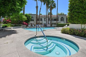 A pool with a slide in the middle of it.