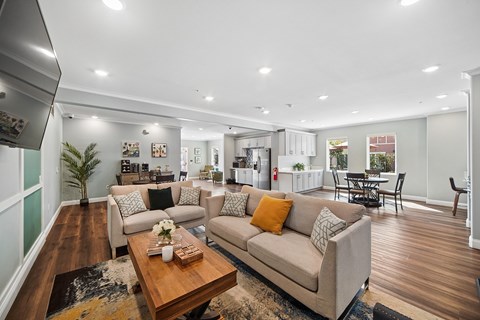 A modern living room with a large couch and a coffee table.