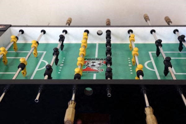 a foosball game table in the onsite game-room