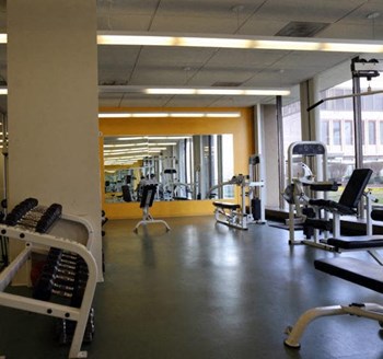 Onsite 24 hour fitness center with a lot of exercise equipment - Photo Gallery 12