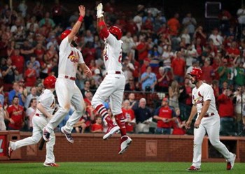 a group St. Louis Cardinal baseball players jumping in the air - Photo Gallery 7