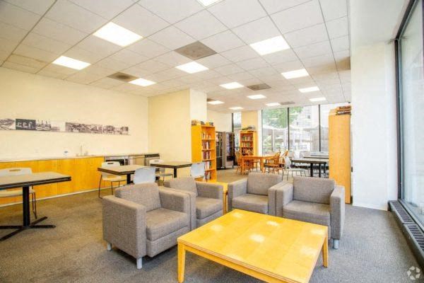 onsite clubroom filled with furniture and a large window