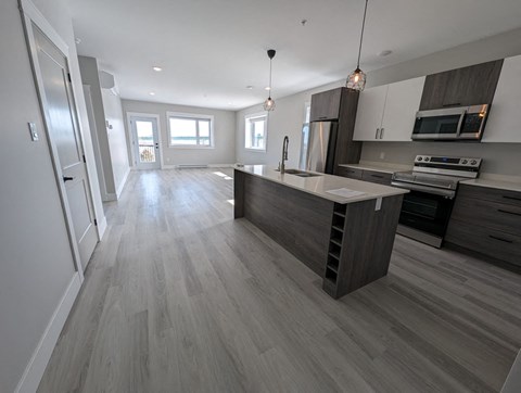 a kitchen with a large island in the middle