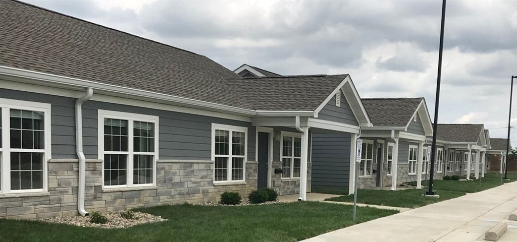 a row of houses on the side of a street
