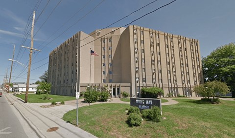 a large building with an flag in front of it