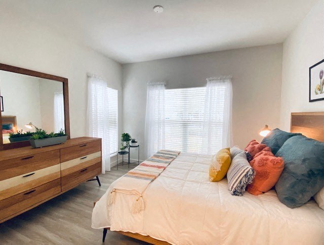 bedroom with a bed and a dresser at Mainstreet Apartments, Clearwater