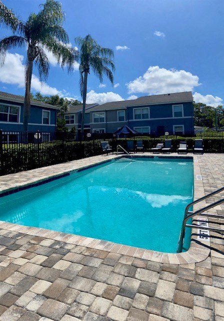 Swimming Pool with Palm Trees at Pineview Apartments in Clearwater, FL 33755