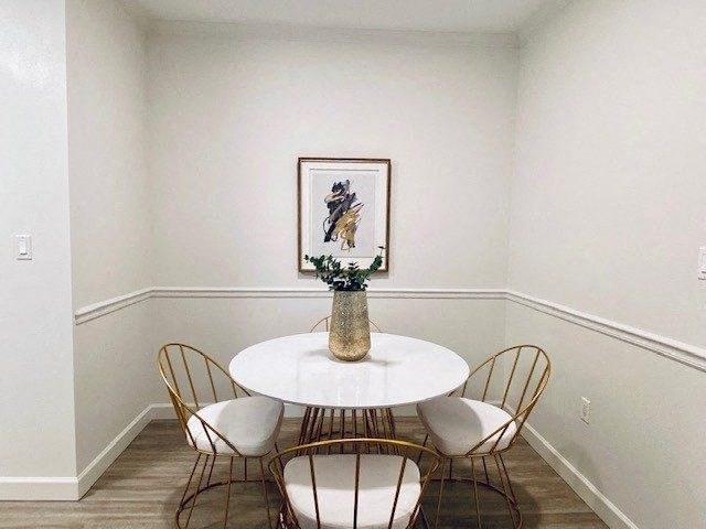 dining room with a white table and chairs at Mainstreet Apartments, Clearwater