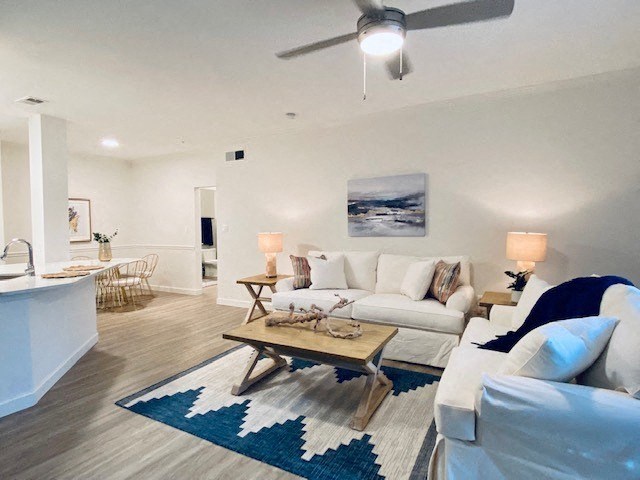 living room with a couch and a table at Mainstreet Apartments, Florida, 33756