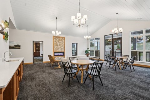 A dining room with a table set for six.