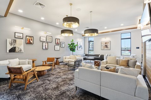 A spacious living room with a variety of furniture and decorative items.
