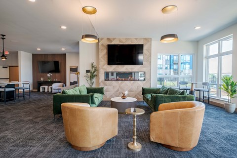 A modern living room with a fireplace and a television.
