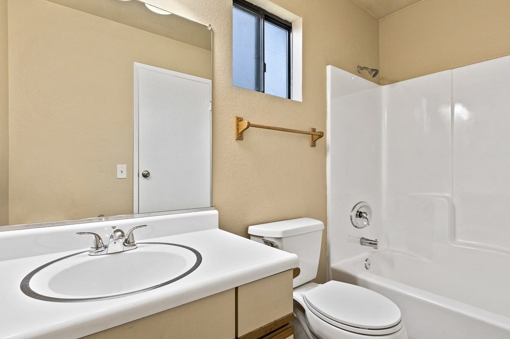 Bathroom of an Upstairs Apartment with Original Amenities