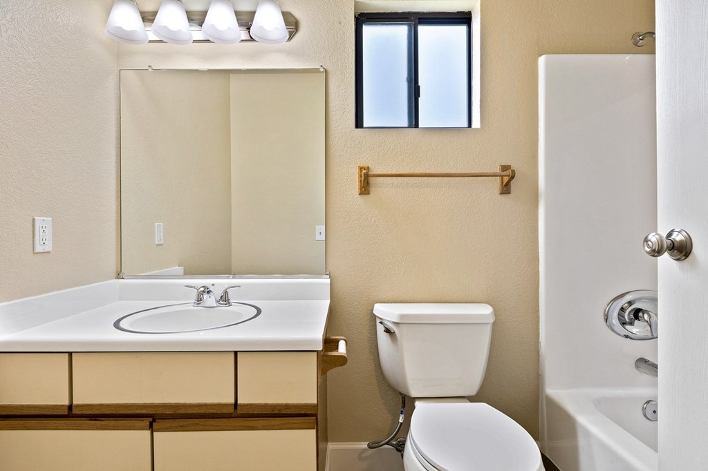 Bathroom of an Upstairs Apartment with Original Amenities