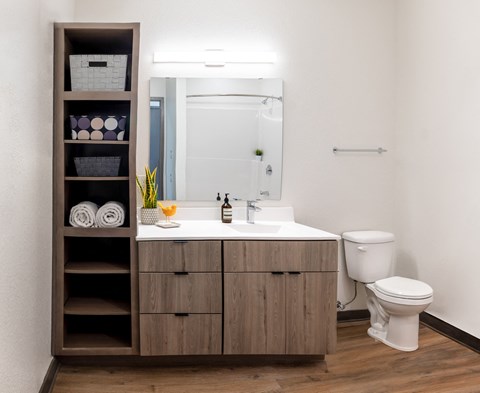 a bathroom with a sink and toilet in a 555 waverly unit