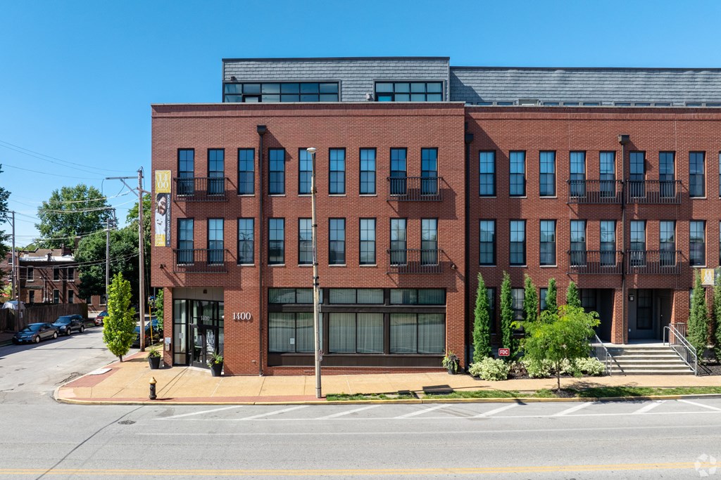 a red brick building on the corner of a street