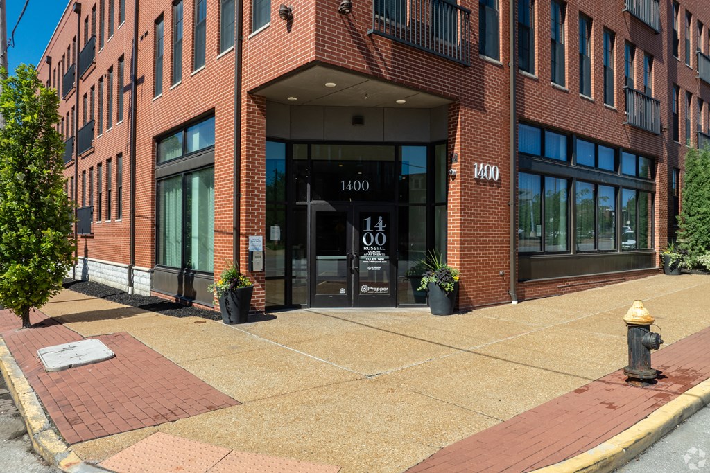 a brick building with a fire hydrant in front of it