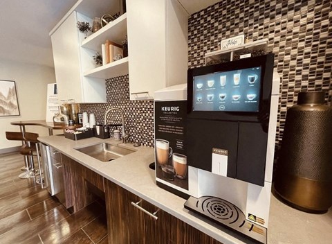 a kitchen with a coffee machine and a sink