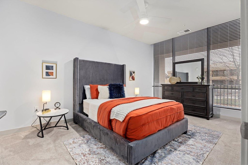 a bedroom with a bed and a window at The Residences at Tesson Ridge, Saint Louis