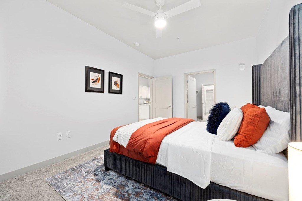a bedroom with a bed and a closet at The Residences at Tesson Ridge, Missouri, 63128
