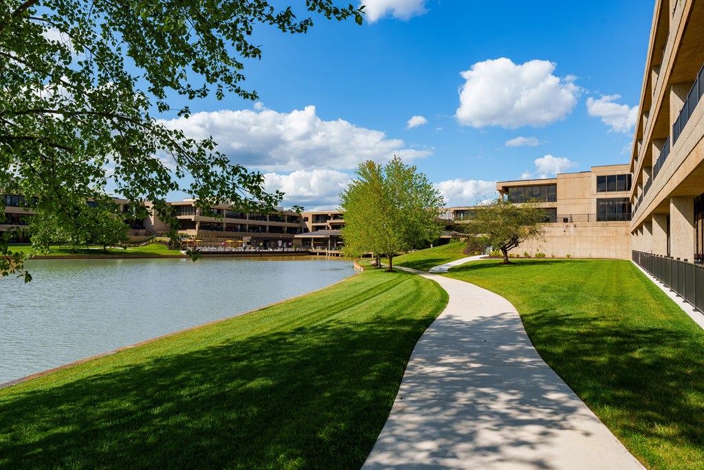 A pathway runs alongside a body of water.