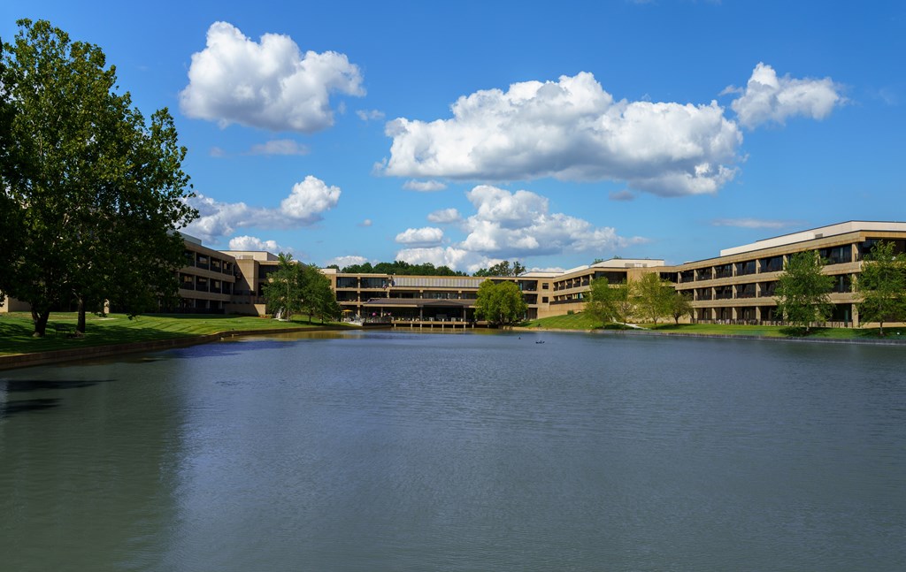 A large body of water in front of a building.