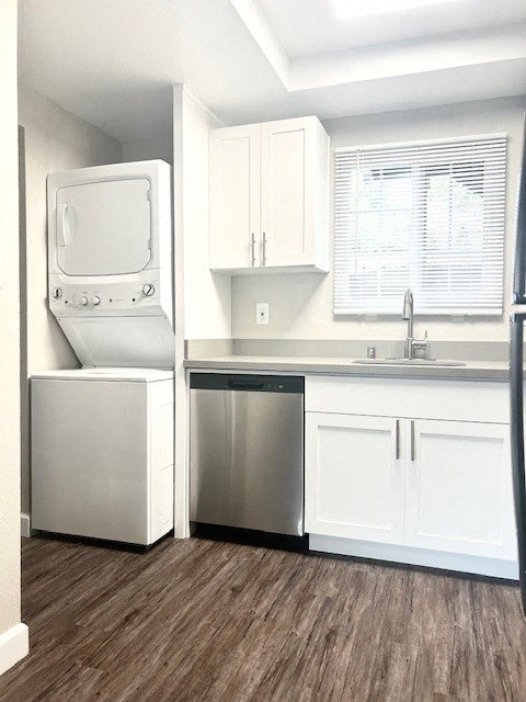 a white kitchen with a washer and dryer in it