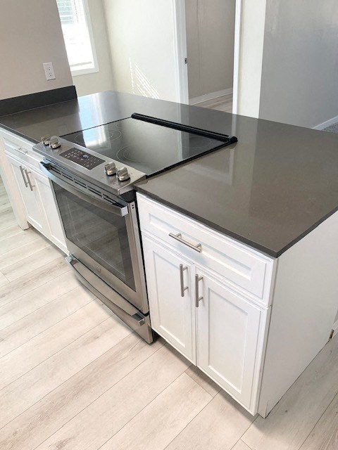a kitchen with a stove and a counter top